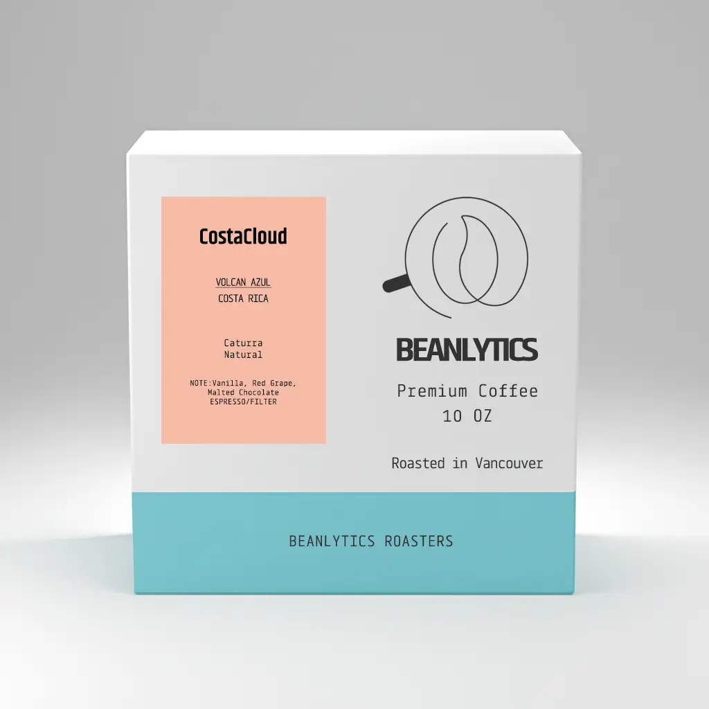 Beanlytics Coffee Roasters packaging for CostaCloud Volcan Azul Costa Rica coffee. Featuring a clean, minimalist design with a white and light blue color palette, the label showcases tasting notes of dried fig and vanilla, the Caturra Natural variety, and brewing methods for espresso and filter. Roasted in Vancouver, the 10 oz premium coffee reflects Beanlytics