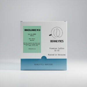 Front view of Beanlytics Roasters coffee box labeled “Brazilliance V1.0,” featuring Vale da Grama Brazil Red Catuai natural coffee. The minimalist packaging shows tasting notes of milk chocolate, almond, honeyed sweetness, and a smooth buttery body, roasted in Vancouver.